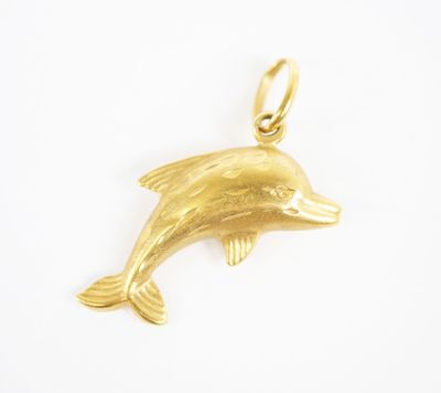a gold dolphin charm on a white background