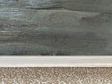 a picture of a painting on the wall of a room