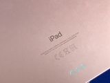 the back side of an ipad with the screen showing the logo