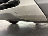 a close up view of a car ' s bumper with a cat on it
