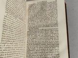 an open book that is sitting on a table