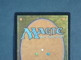 a close up of a magic the gathering card on a table