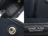 the inside of a black purse with a leather handle