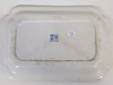 a white plate with a blue and white design on it