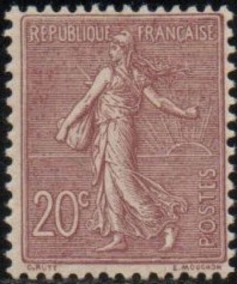 a stamp with a woman holding a basket on it