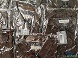 many bags of luggage that are wrapped in foil