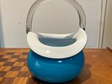 a blue and white bowl sitting on a wooden table