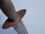 a close up of a knife with a blade sticking out of it