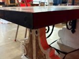 a table that has a piece of wood on top of it