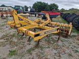 an image of a tractor plow in a field