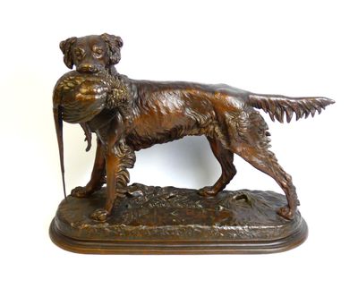 bronze statue of a dog holding a bird in its mouth