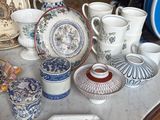 a table with a lot of china and other items on it