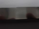 a knife that is sitting on a table in a room