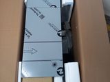 une boîte en carton remplie de divers appareils électroniques