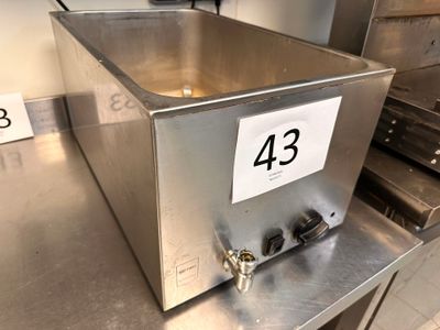 a metal box with a number on it sitting on a counter