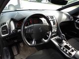 the interior of a car with a steering wheel, dashboard, and dash board