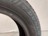 a close up of a tire on a white surface