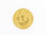 une image représentant une pièce d'or sur laquelle figurent un bateau et des fleurs