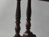 an old wooden table with two legs and a table top on it