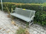 a bench that is sitting on the side of the road