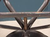 an image of a metal chair with a wooden seat