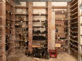 many bottles of wine on the shelves in the wine cellar