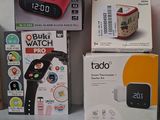 several boxes of electronic gadgets are lined up on a table