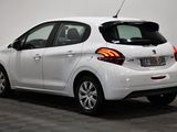 a picture of a white car parked in a room