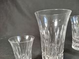 three glass vases sitting next to each other on a table
