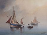 three boats that are floating in the water on a foggy day