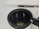 a close up of a car ' s plugged in to a charger
