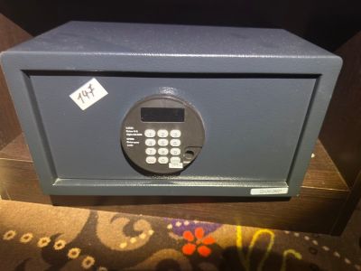 a small safe box with a calculator in it