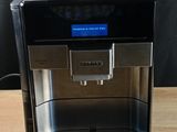 an image of a coffee machine on a wooden table