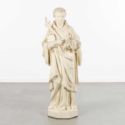 a white statue of a woman holding a bouquet of flowers