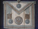 an image of a masonic apron hanging on a wall
