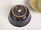 two bowls and a bowl on a white table