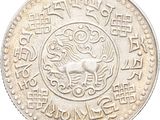 a close up of a coin on a white background with chinese writing