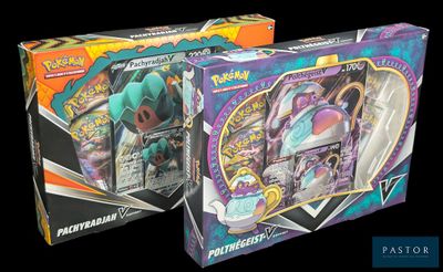 two boxes of pokemon cards are shown in a black background