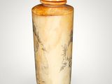 a vase with a lid that has a painting on it