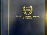 Le livre est bleu et doré, avec un emblème représentant un couronne de laurier.