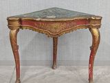 a small table that has a marble top on it