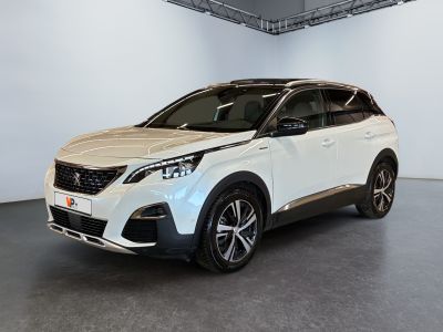 the white suv is parked in a large room
