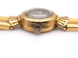 an image of a close up of a watch on a white surface
