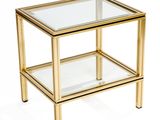 table d'appoint dorée avec un plateau en verre et des pieds en métal