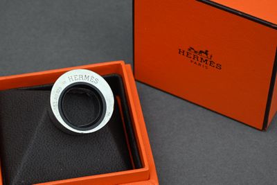 an orange box with a ring inside of it sitting on a table