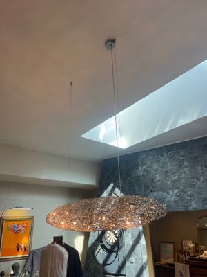 a light that is hanging from the ceiling in a room
