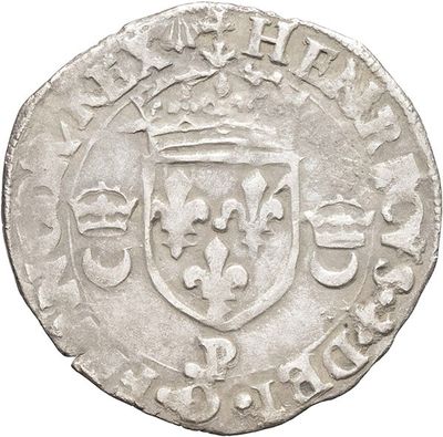 a close up of a coin with a coat of arms on it