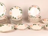 a lot of plates that are sitting on a table