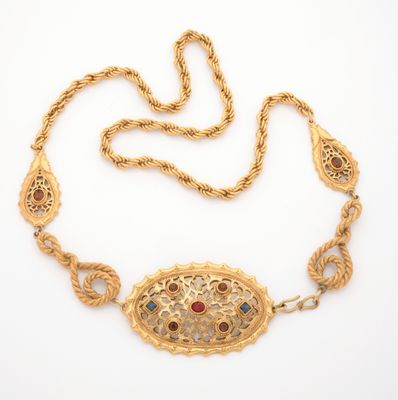 an image of a gold necklace with multi colored stones on it