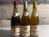 three bottles of wine sitting next to each other on a table